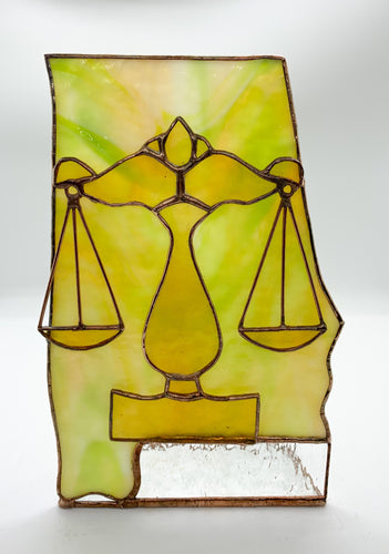 Scales of Justice on State of Alabama
